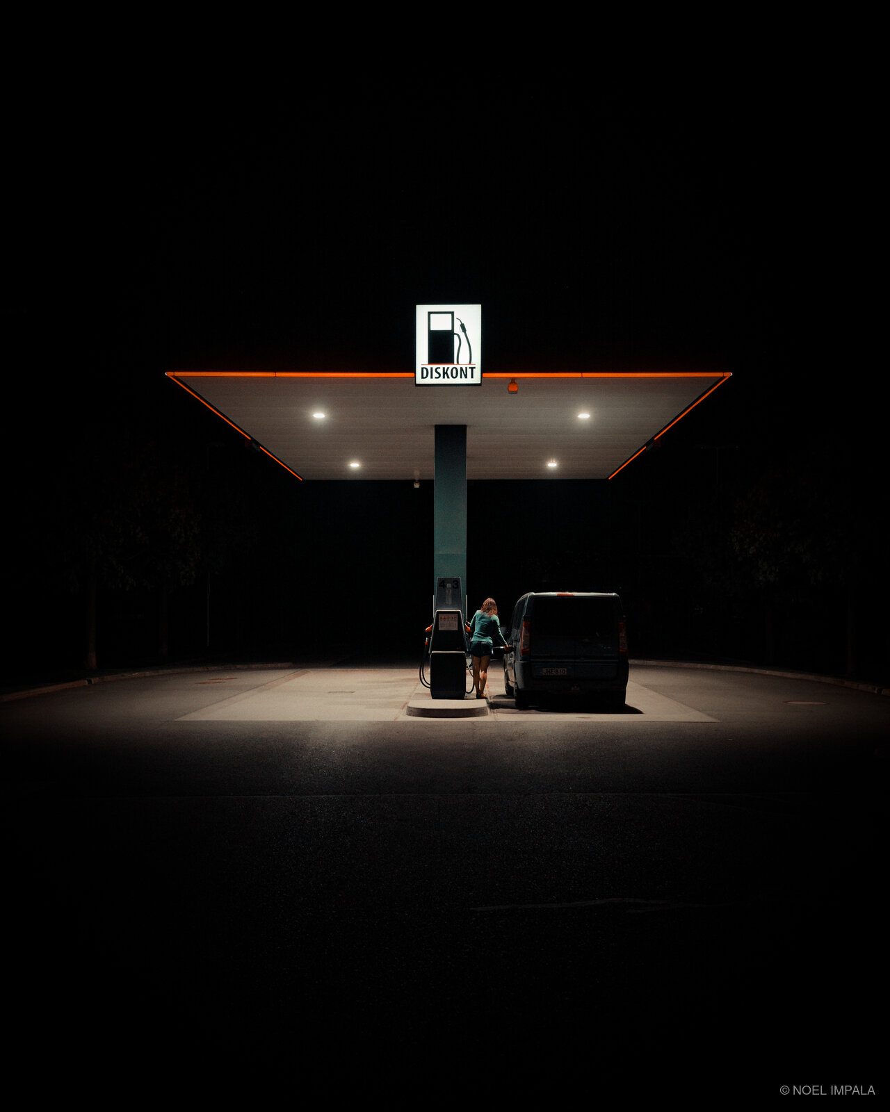 Gas station glowing in darkness